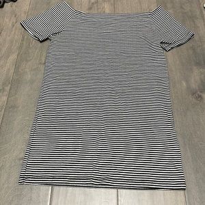 White and black striped, medium sized shirt for women.